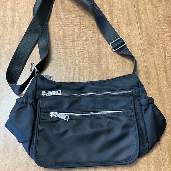 Black Crossbody Bag with Adjustable Strap and Minimalist Design - Picture 1 of 9